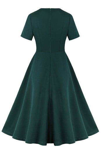 Dunkelgrünes kurzärmeliges Kleid mit Rüschen aus den 1950er Jahren