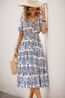 Laden Sie das Bild in den Galerie-Viewer, Blaues Midikleid mit A-Linien-Print