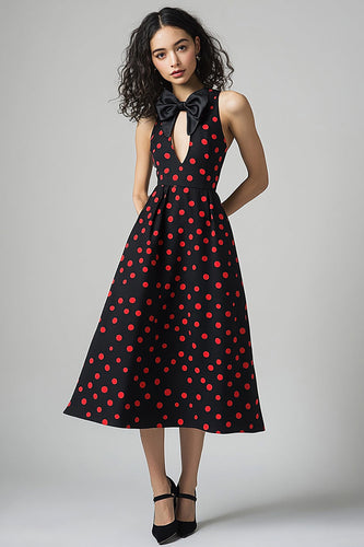 Schwarzes rotes Polka Dots Kleid mit Schleife