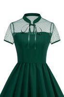 Laden Sie das Bild in den Galerie-Viewer, Schwarzes Halsausschnitt A-Linien Kleid der 1950er Jahre mit Punkten