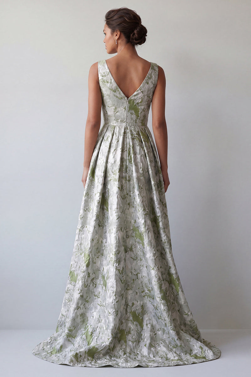 Laden Sie das Bild in den Galerie-Viewer, Ein hellgrünes, gezocktes Mutter-der-Braut-Kleid mit einer hellgrünen Blume und Taschen
