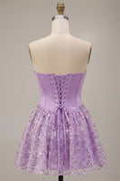 Laden Sie das Bild in den Galerie-Viewer, Fliederfarbene Korsett-Pailletten Appliquen Satin A-Linie trägerloses kurzes Homecoming-Kleid