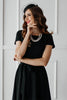 Laden Sie das Bild in den Galerie-Viewer, Schwarzes Vintage Kleid 1950er Jahren mit Ärmeln