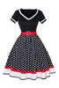 Laden Sie das Bild in den Galerie-Viewer, Schwarzes Polka Dots Rockabilly Kleid mit V-Ausschnitt aus den 1950er Jahren