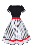 Laden Sie das Bild in den Galerie-Viewer, Schwarzes Polka Dots Rockabilly Kleid mit V-Ausschnitt aus den 1950er Jahren