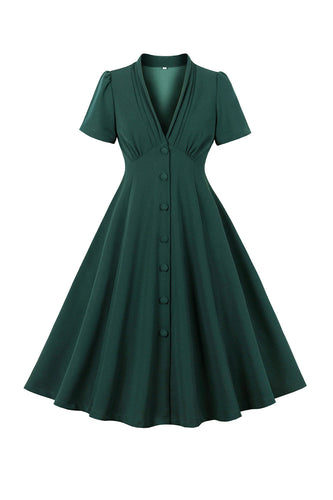 Grünes Kleid mit tiefem V-Ausschnitt aus den 1950er Jahren und kurzen Ärmeln