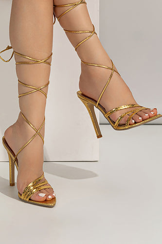 Goldene Stiletto Sandalen mit offener Zehenpartie und Schnürung