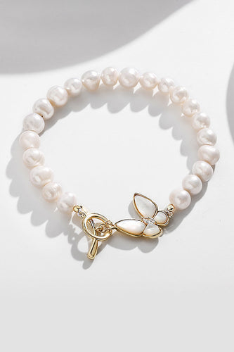 Funkelndes weißes Perlen-Stretch-Armband mit Schmetterling